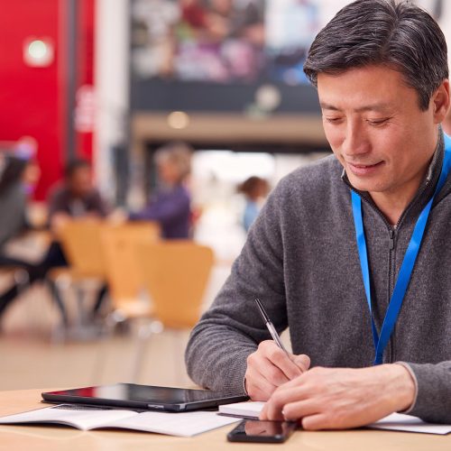 mature-male-teacher-or-student-with-digital-tablet-LA2U66R.jpg